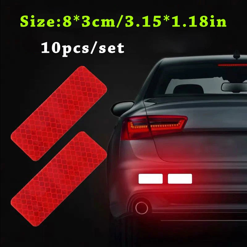 Ten sets of red reflective safety strips for vehicles shown next to a dark car body.
