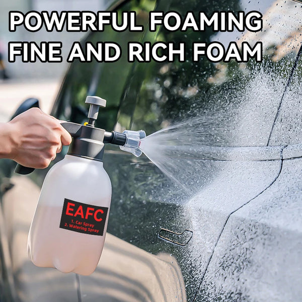 A hand is using a heavy duty foam sprayer to apply fine and rich foam to a car's exterior.