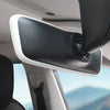 A close-up view of a silicone rearview mirror edge protector installed on a vehicle interior.