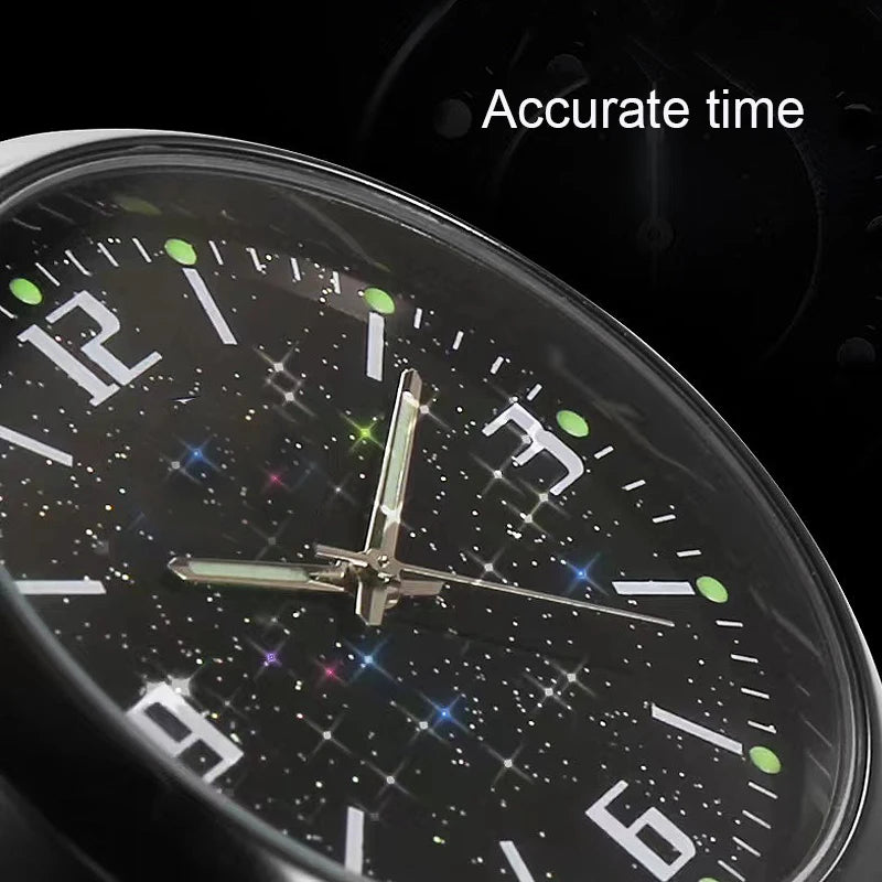 Close-up of a stick-on car clock displaying accurate time against a dark, starry background.