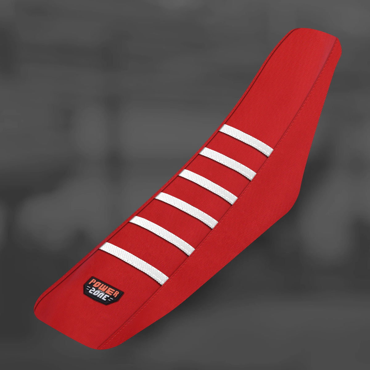 A red motorcycle seat cover featuring white stripes, shown in a diagonal angle.
