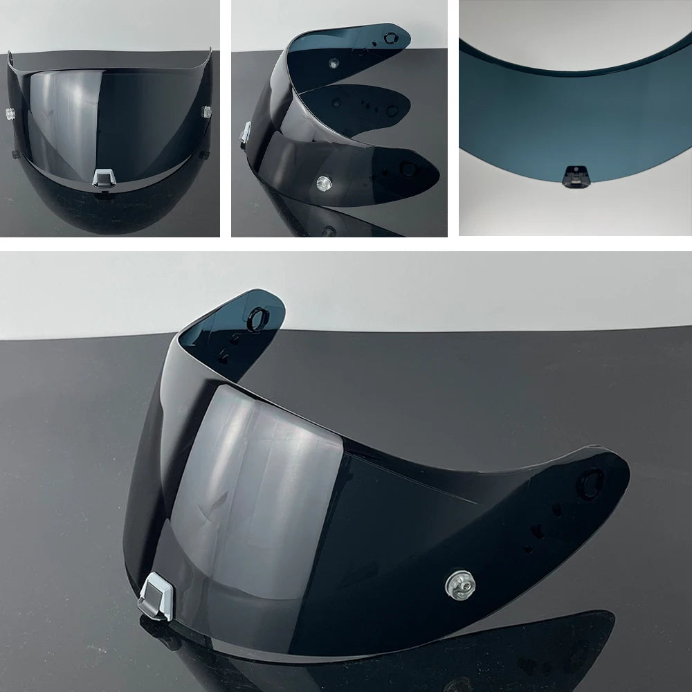 A black motorcycle helmet visor lens is shown in various angles, demonstrating its curved shape and protective design.