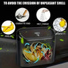 A black portable car trash can with a hanging lid, shown next to various items like cigarette end, wet tissue, and confetti.