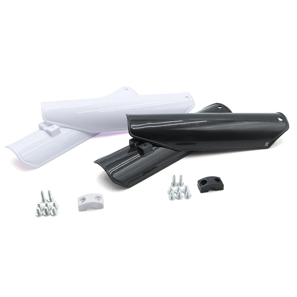 Motorcycle front fork guard kit showing white and black protective guards and mounting hardware
