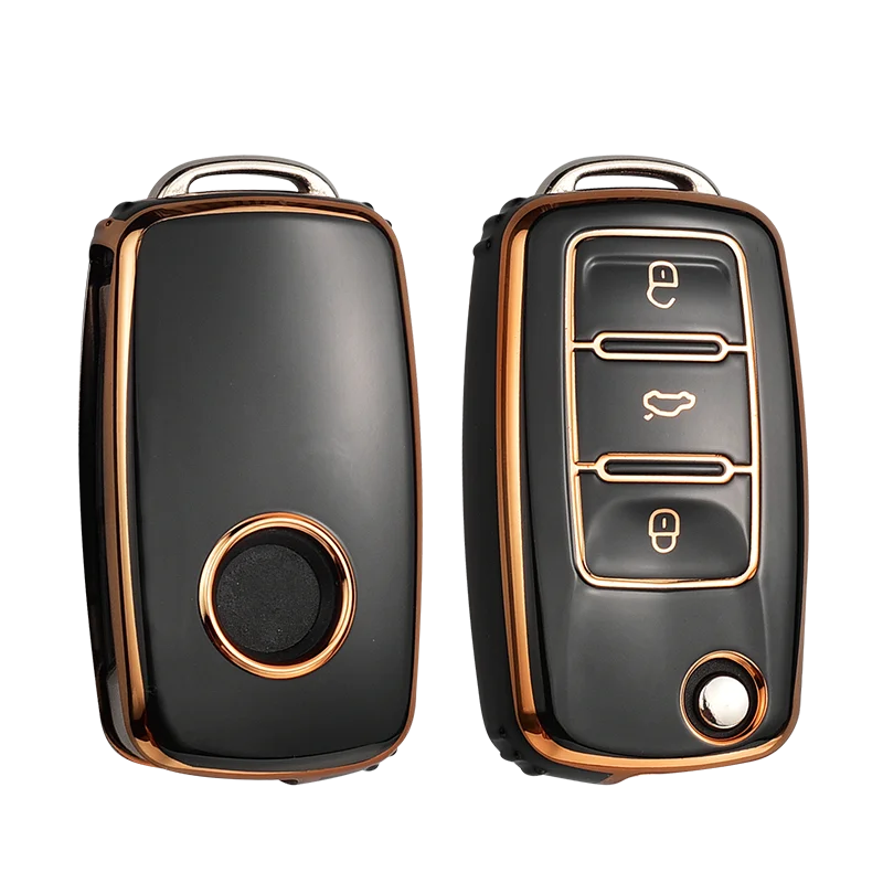 A pair of black TPU car key covers with copper accents shown against a black background.