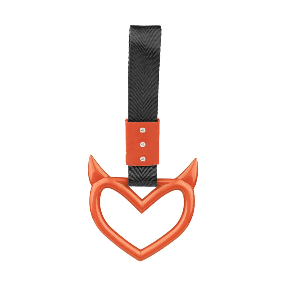 Black strap handle accessory with an orange heart shape for automotive use