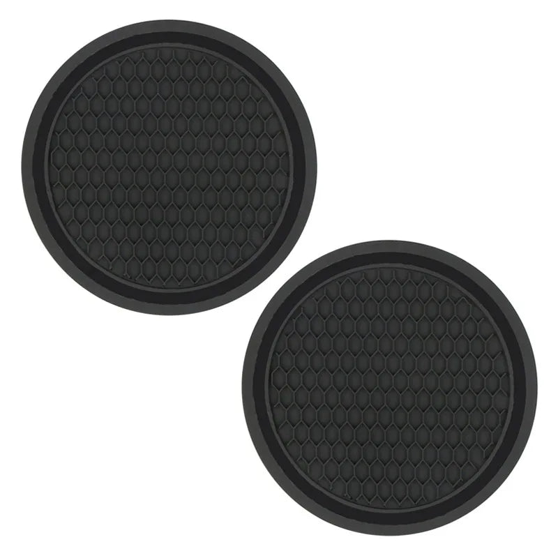 A set of black decorative rhinestone coasters with a honeycomb pattern.