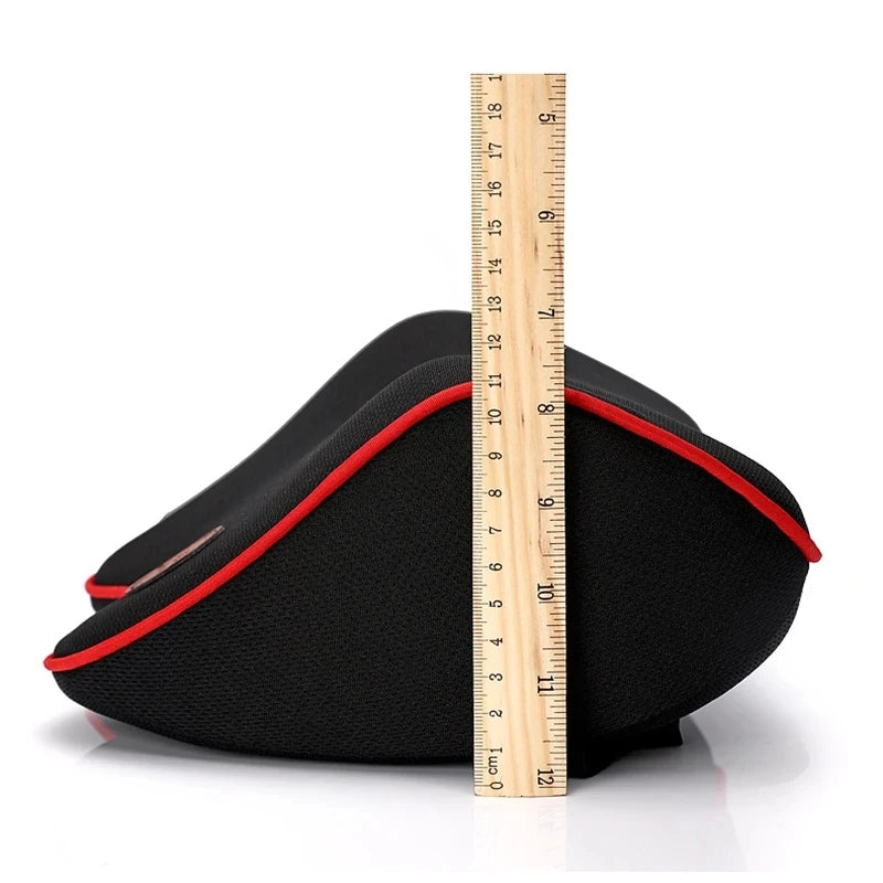 Black memory foam car headrest neck pillow shown next to a ruler for size reference