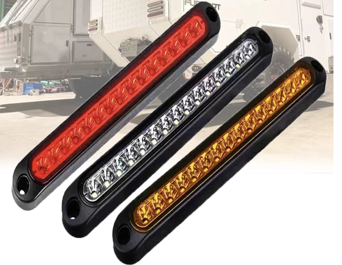 Three heavy duty truck and trailer light bars in red, white, and amber colors displayed against a white truck background.