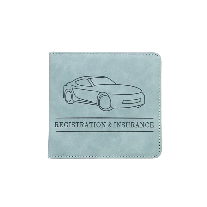 A light blue leather document holder featuring a line drawing of a car and the text Registration & Insurance.