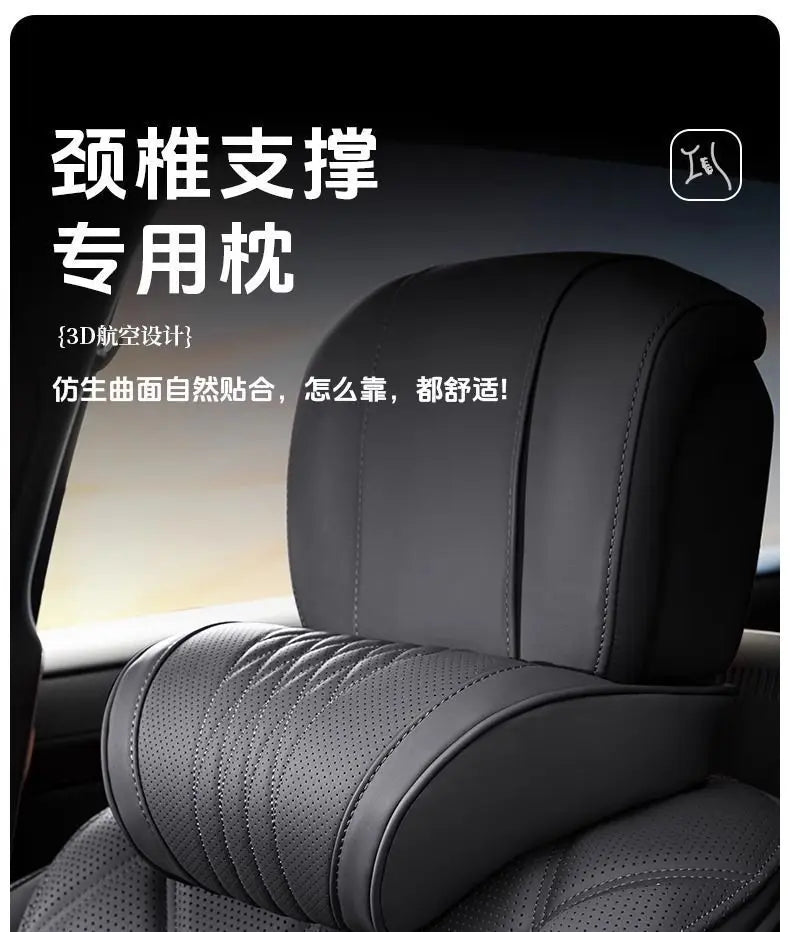 Black memory foam car headrest with a leather cover shown in a vehicle interior.