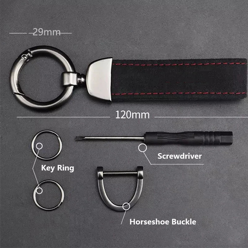 A black suede leather car keychain featuring a key ring, screwdriver, and horseshoe buckle.