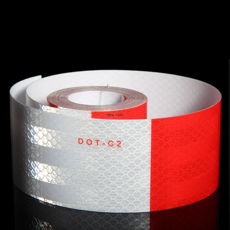 Roll of high-visibility reflective safety tape with white and red stripes and the text DOT C2