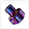 A close-up view of a titanium key head cover for motorcycles with a metallic purple and blue iridescent finish.