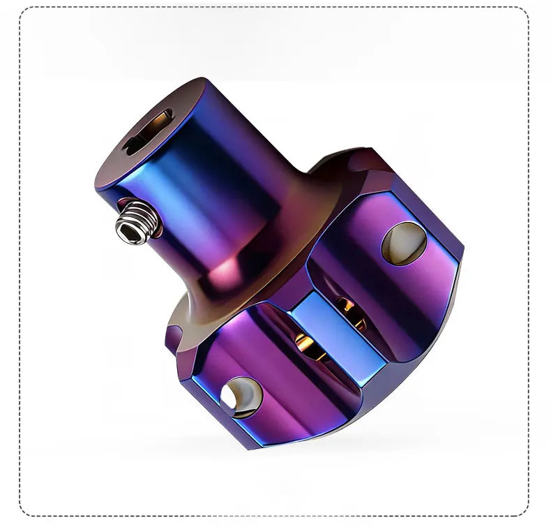 A close-up view of a titanium key head cover for motorcycles with a metallic purple and blue iridescent finish.