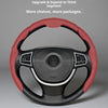 A close-up view of a red and black steering wheel cover for a vehicle.