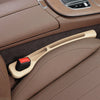 A beige car seat gap plug and storage organizer is shown in a brown leather seat interior.