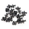 A collection of black plastic fasteners used for vehicle trim.
