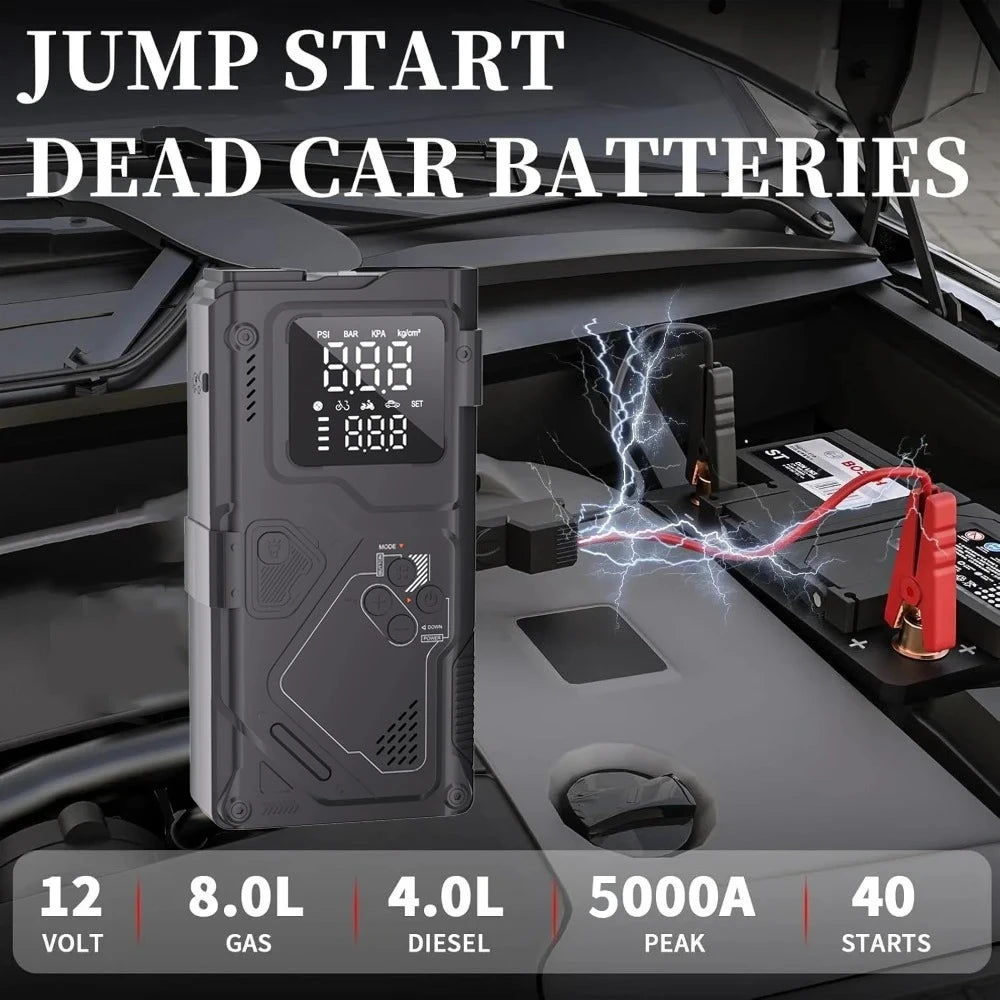 Un arrancador portátil se muestra en el compartimento del motor de un vehículo, listo para usar.