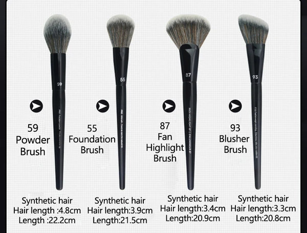 A set of four black makeup brushes including a powder, foundation, fan, and blusher brush with synthetic hair.