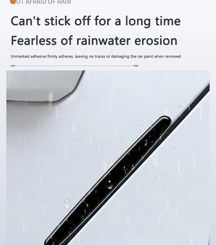 Close-up of a black adhesive sticker protecting a white car door handle from rainwater erosion.