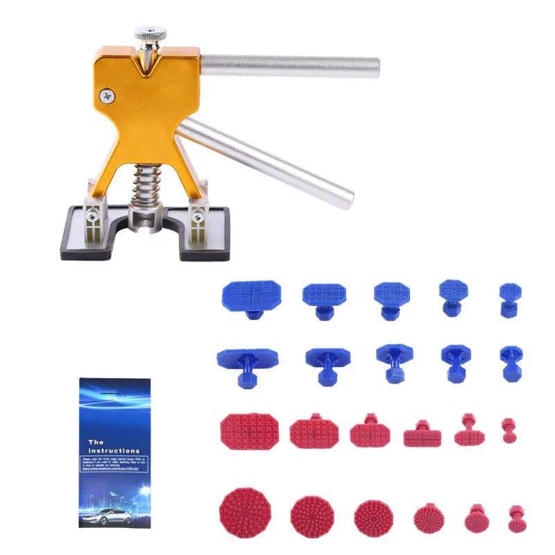 A set of plastic dent pullers and tools for auto repair, including a yellow and silver puller device and various sized plasti