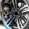 Close-up view of a diamond rhinestone tire valve caps set installed on a metallic wheel rim.