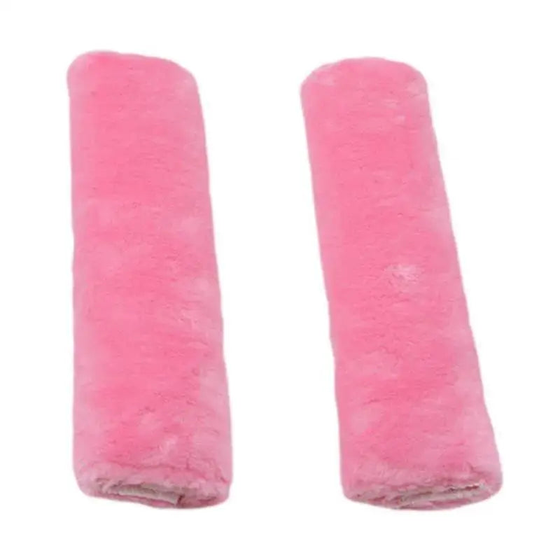 Pair of pink luxury car seatbelt shoulder pads.