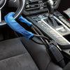 A blue strap attached to a steering wheel is connected via a cable to a seatbelt anti-theft lock device.