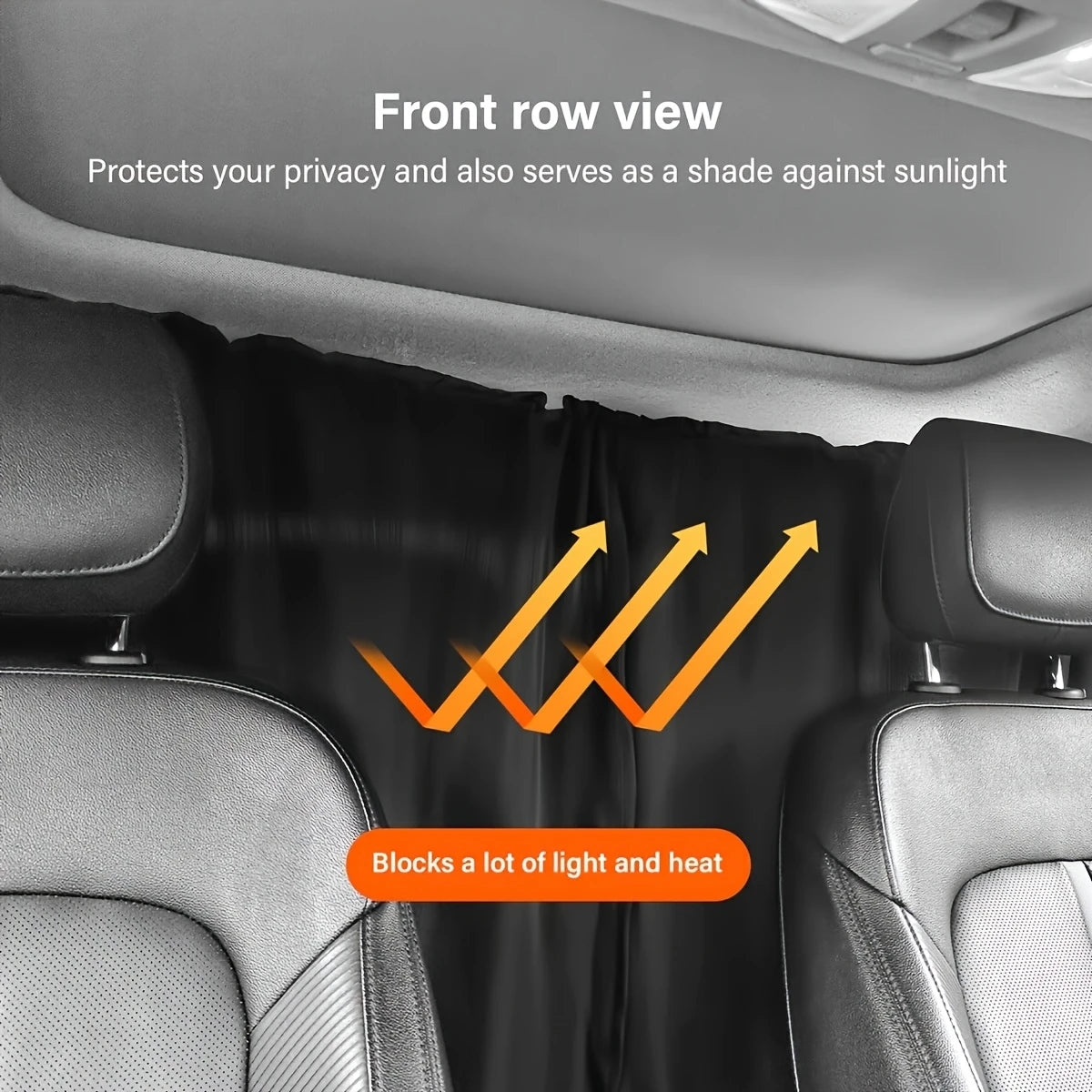 Front row view of a black privacy curtain set protecting a car window from sunlight and heat.