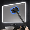A black car windshield cleaning tool with a blue sponge head is shown against a lighted mirror.