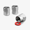 Three silver metal tire valve caps with VW logos and a red rubber ring.