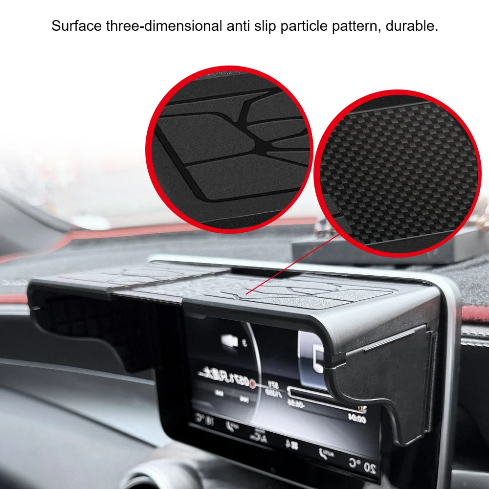 Close-up of a car GPS navigator sun shield with an anti-slip particle pattern on the visor.
