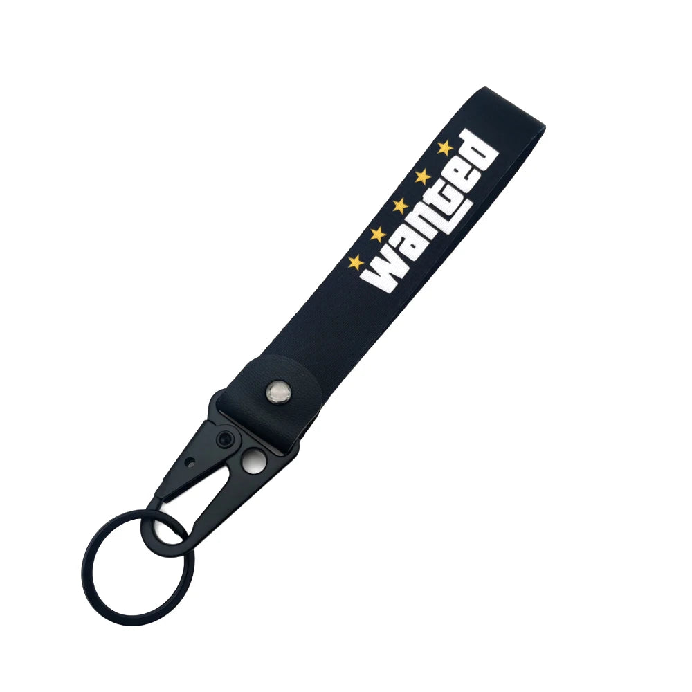 Porte-clés en nylon noir avec le mot WANGED brodé