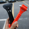 A hand holds an orange heavy-duty emergency window breaker and seatbelt cutter tool.