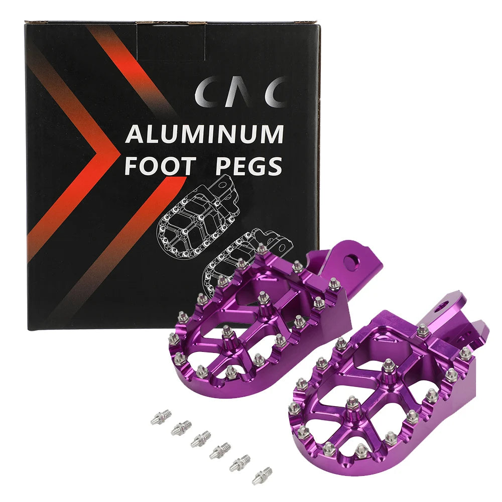A box and several purple aluminum foot pegs for motorcycles.