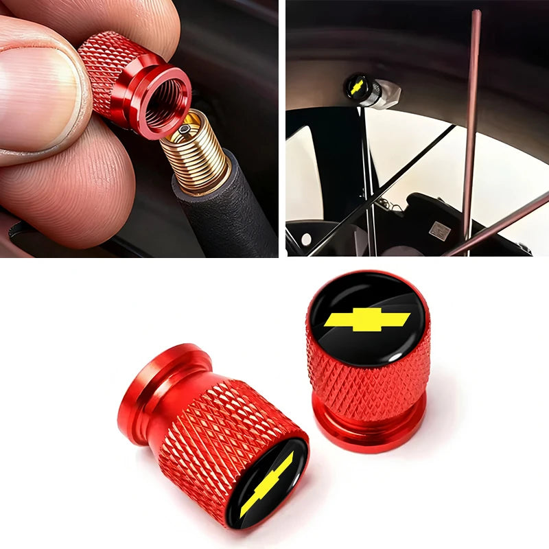 Close-up view of a red aluminum tire valve cover with a yellow lightning bolt design.