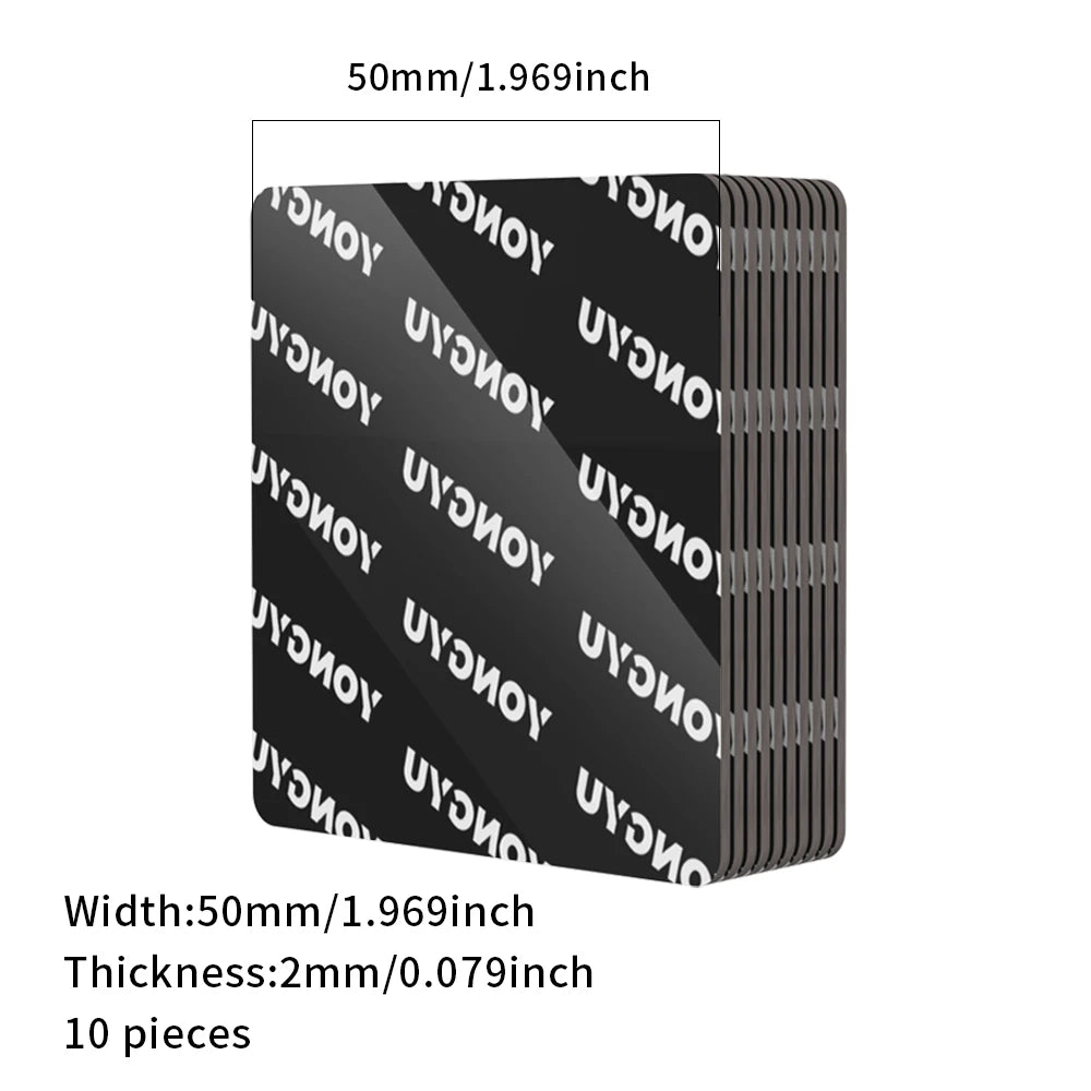 A stack of ten black heavy duty double-sided adhesive pads, measuring 50mm thick.