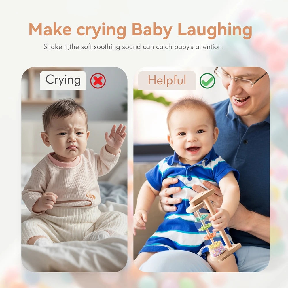 A baby is laughing while playing with a wooden rainmaker musical toy.