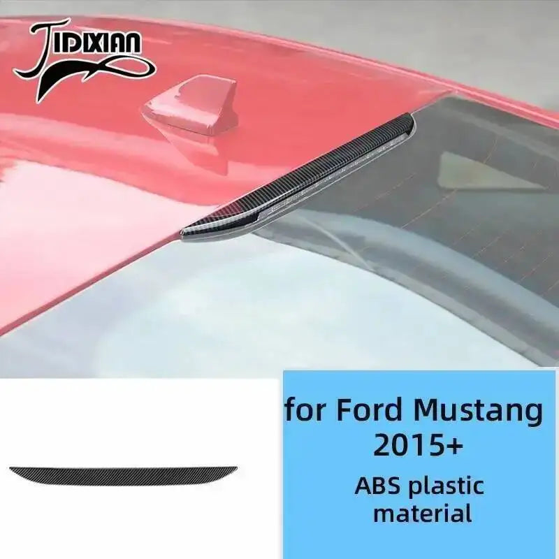 A close-up view of a red Ford Mustang interior trim piece with a black accent, made from ABS plastic material.