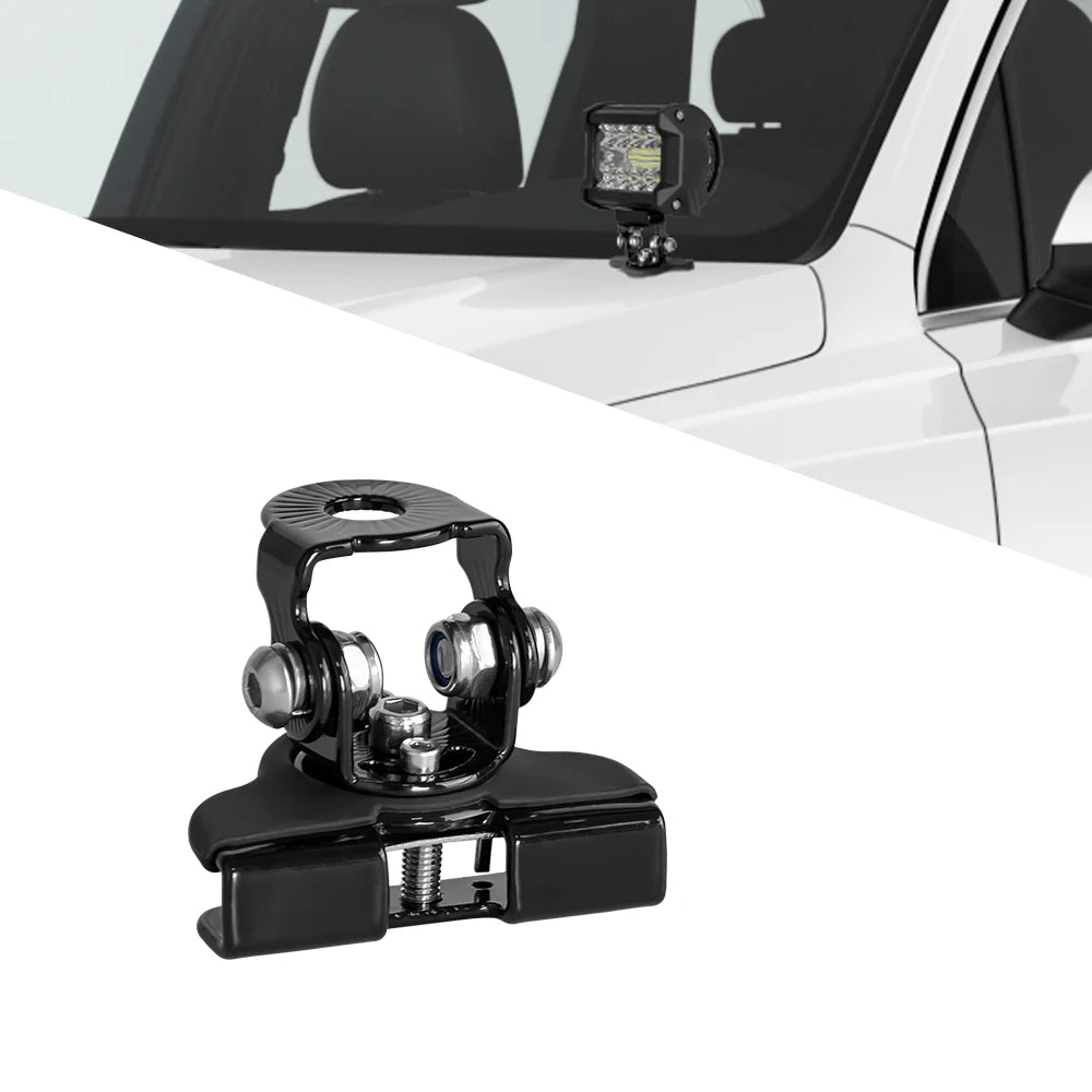 Black mounting brackets for a universal LED light bar, shown against a white vehicle interior.