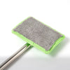 A grey microfiber cleaning brush attached to a silver telescopic handle for automotive glass.