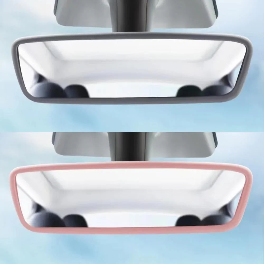 A close-up view of a silicone rearview mirror edge protector in pink and gray colors.