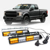 A black Ford F-150 pickup truck with aftermarket emergency dash strobe lights installed on the front grille.