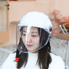 A woman wearing a clear half helmet and white jacket is shown indoors.