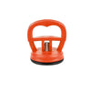 Orange car dent remover puller with a handle and suction cup mechanism