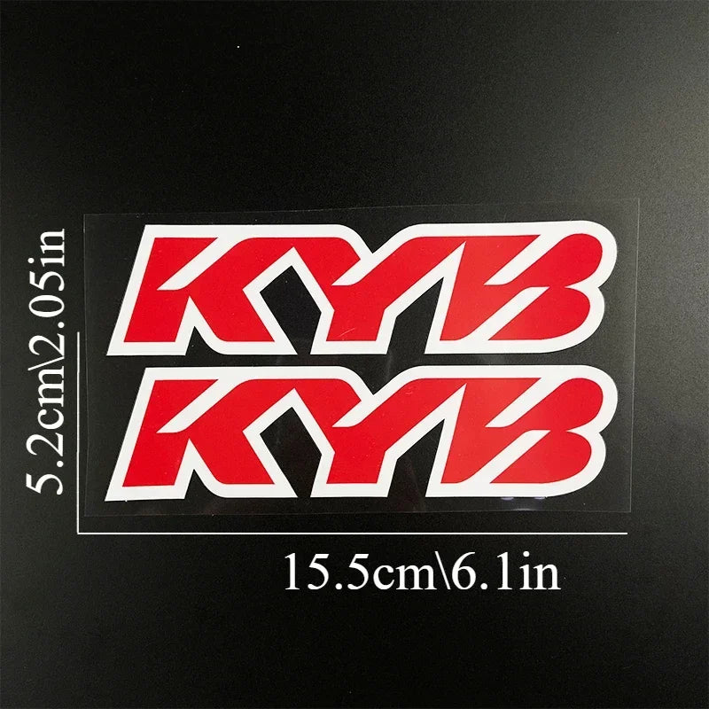 Two red KYB racing suspension decals displayed on a black background.
