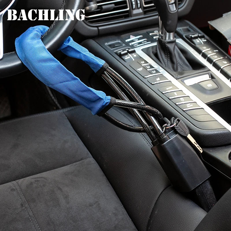 A blue fabric steering wheel and seatbelt anti-theft lock mechanism is shown in a car interior context.