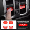Red button protective covers for Jeep Wrangler window controls shown in a vehicle interior.
