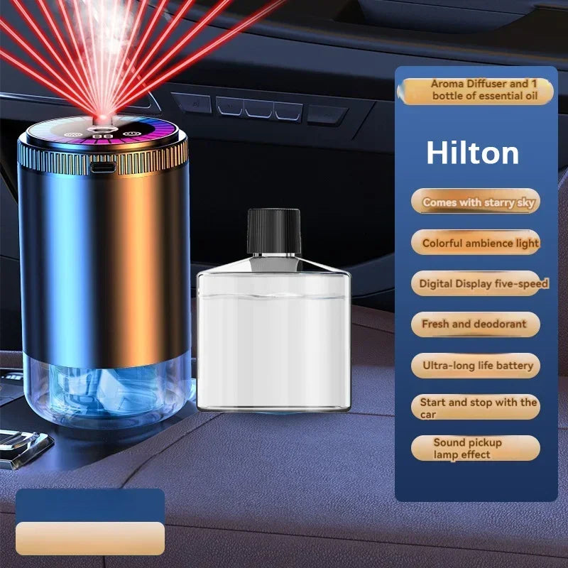 A Hilton aroma diffuser with a bottle of essential oil and various features displayed on a dark surface.